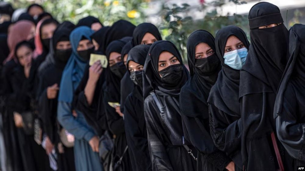 female afghan students stand in a queue after they arrive for entrance exams at kabul university in kabul on oct 13 2022 after the hardline taliban regained power in afghanistan they banned girls education past the sixth grade photo afp