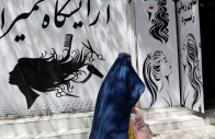 an afghan woman walks past a beauty salon in kabul afghanistan july 6 2023 file photo reuters