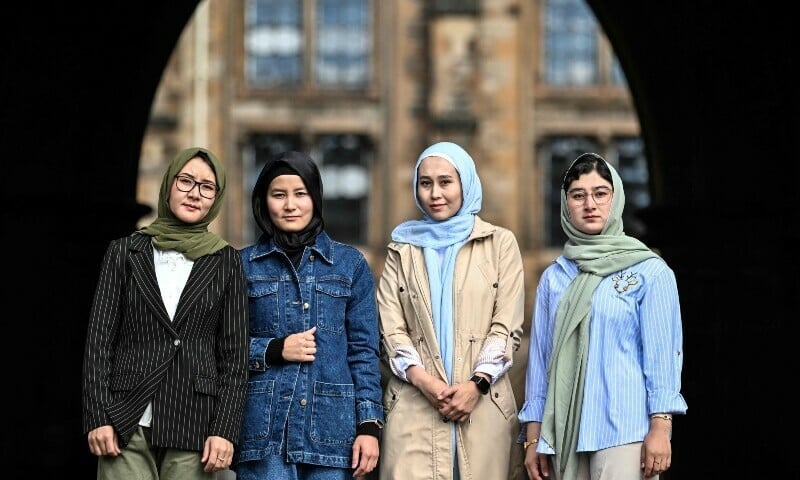 four female medical students take in their new surroundings at the university of glasgow as they prepare to embark on a one year access to medicine programme called gateway to medical studies in glasgow on september 13 afp