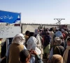 people gather as they wait to cross at the friendship gate crossing point in the pakistan afghanistan border town of chaman pakistan august 12 2021 photo reuters
