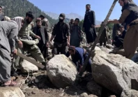 a massive flood brought huge boulders that smashed into buildings in afghanistan s parun photo afp