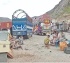 afghan nationals wait beside their belongings at the torkham border s transit point as pakistan steps up its deportation of undocumented migrants sending over 2 239 afghans back across the frontier photo online