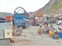 afghan nationals wait beside their belongings at the torkham border s transit point as pakistan steps up its deportation of undocumented migrants sending over 2 239 afghans back across the frontier photo online file