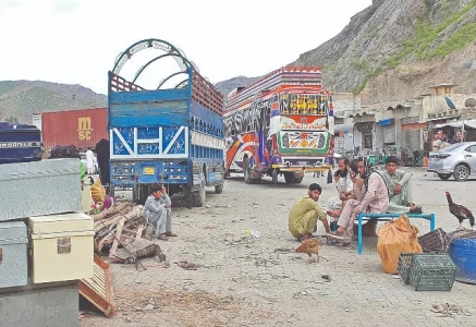 afghan nationals wait beside their belongings at the torkham border s transit point as pakistan steps up its deportation of undocumented migrants sending over 2 239 afghans back across the frontier photo online file
