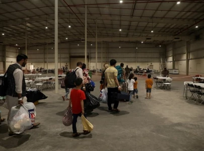 afghan government urges its citizens stranded in qatar while awaiting us visas to return home