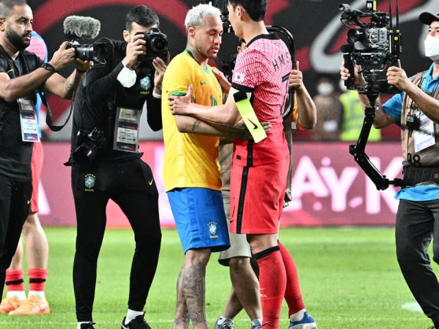 brazil s neymar and south korea s son heung min hug at full time on the last occasion the two teams met in seoul in 2022