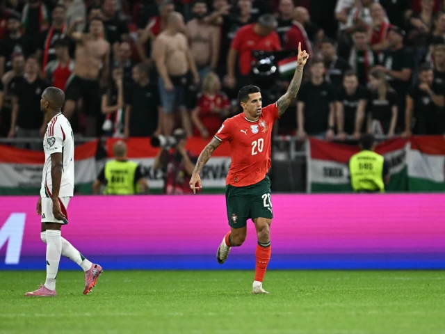 portugal defender joao cancelo stroked home a late winner from outside of the box to claim his team a qualifying victory photo afp portugal defender joao cancelo stroked home a late winner from outside of the box to claim his team a qualifying victory photo afp