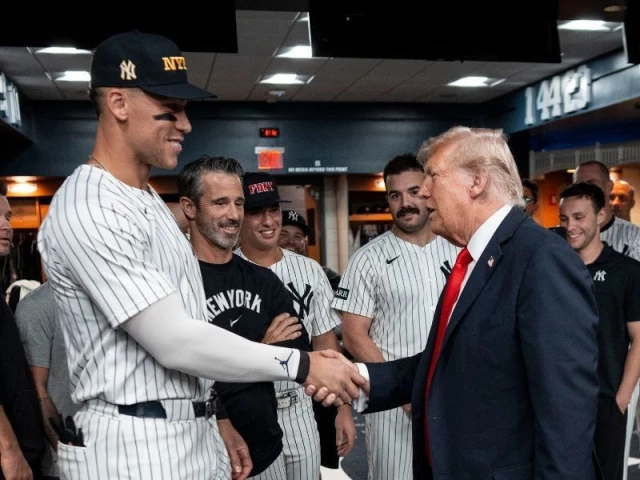 president donald trump greets yankees aaron judge and other players in the locker room ahead of the yankees baseball game against the detroit tigers at the yankee stadium in the bronx new york on september 11 2025 photo afp