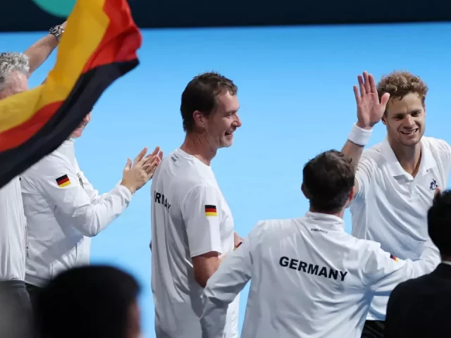 germany s yannick hanfmann top r celebrates with teammates after his victory over japan s shintaro mochizuki in davis cup second round qualifiers photo afp