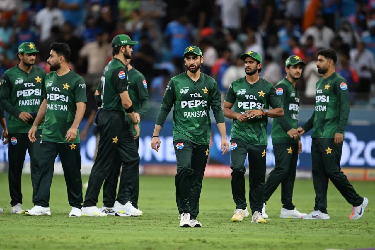 salman ali agha walks off with his teammates after pakistan s defeat against india in the asia cup photo afp