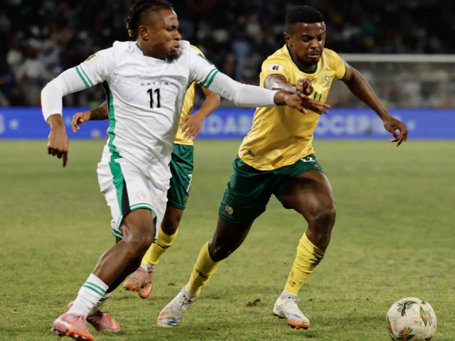 nigeria s samuel chukwueze fights for the ball with south africa s teboho mokoena r during their world cup qualifier in september photo afp