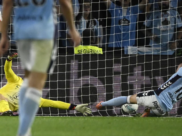 celta vigo s spanish forward iago aspas scores his team s equaliser in the draw against atletico madrid in la liga photo afp