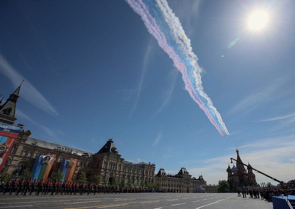 Russian Su-25 assault aircrafts release smoke in the colours of the Russian flag while flying over Red Square. PHOTO: AFP