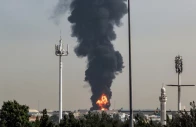 black smoke rising from a strike on an oil depot photo afp