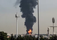 black smoke rising from a strike on an oil depot photo afp