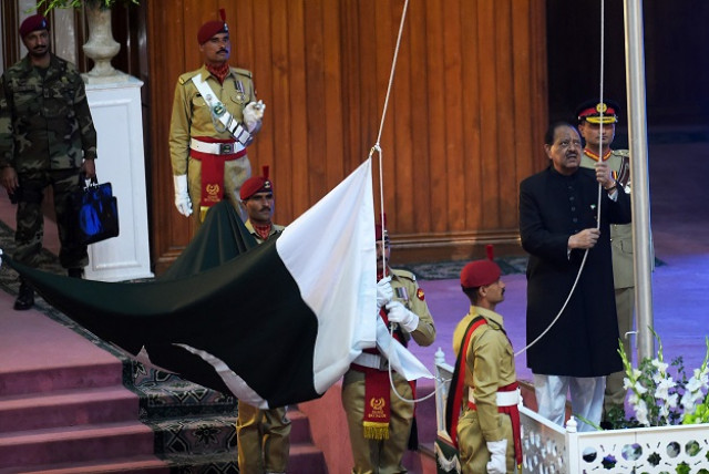 pakistan s president mamnoon hussain r hoists national flag during a ceremony to mark the independence day in islamabad on august 14 2017 photo afp pakistan s president mamnoon hussain r hoists national flag during a ceremony to mark the independence day in islamabad on august 14 2017 photo afp