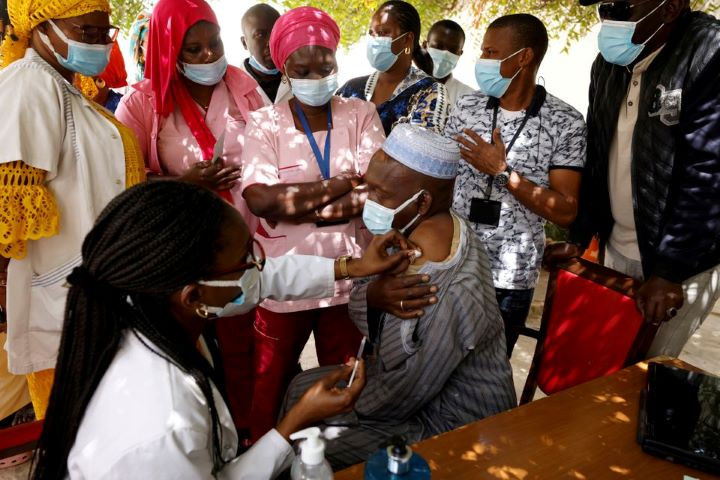 a health worker receives a dose of coronavirus disease covid 19 vaccine in dakar senegal photo reuters file