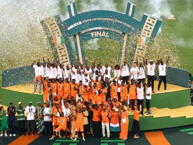 ivory coast s max gradel lifts the trophy as he celebrates with teammates after winning the africa cup of nations in final between nigeria v ivory coast at stade olympique alassane ouattara abidjan ivory coast on february 11 2024 file photo reuters