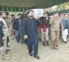 khyber pakhtunkhwa chief minister sohail afridi carries the coffin of martyred captain abbas khan in peshawar photo express