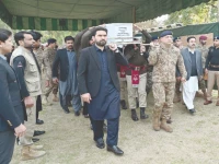 khyber pakhtunkhwa chief minister sohail afridi carries the coffin of martyred captain abbas khan in peshawar photo express