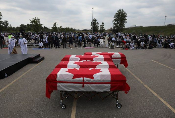 flag wrapped coffins are seen outside the islamic centre of southwest ontario during a funeral of the afzaal family that was killed in what police describe as a hate motivated attack in london ontario canada june 12 2021 reuters carlos osorio