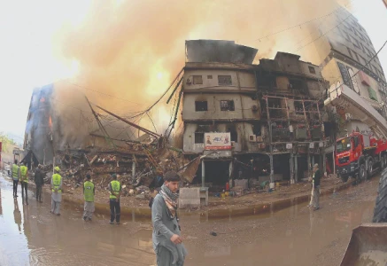 smoke billows from karachi s gul plaza following a massive fire photo inp smoke billows from karachi s gul plaza following a massive fire photo inp