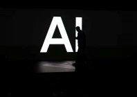 a screen reads ai in reference to artificial intelligence as attendees gather during rivian s first autonomy and ai day showcasing developments in self driving technology in palo alto california us december 11 2025 reuters