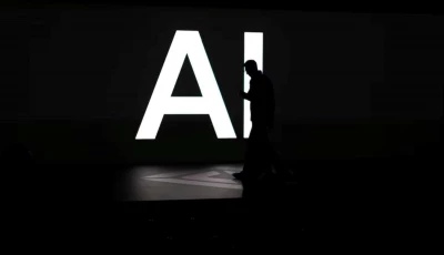 a screen reads ai in reference to artificial intelligence as attendees gather during rivian s first autonomy and ai day showcasing developments in self driving technology in palo alto california us december 11 2025 reuters