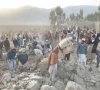 afghan men gather at the site of an overnight air strike in girdi kas village of bihsud district of nangarhar province photo afp afghan men gather at the site of an overnight air strike in girdi kas village of bihsud district of nangarhar province photo afp