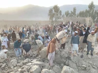 afghan men gather at the site of an overnight air strike in girdi kas village of bihsud district of nangarhar province photo afp afghan men gather at the site of an overnight air strike in girdi kas village of bihsud district of nangarhar province photo afp