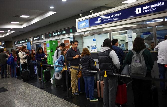 stranded passengers wait in line at the aerolineas argentinas customers service office at the aeroparque jorge newbery airport during an aviation unions strike in buenos aires on sept 13 2024 photo reuters