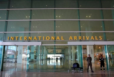 airport security force asf personnel stand guard at the international arrivals of islamabad international airport photo reuters