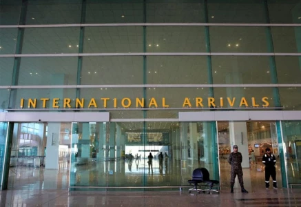 airport security force asf personnel stand guard at the international arrivals of islamabad international airport photo reuters