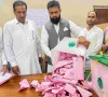 a polling officer opens a ballot box for counting at a polling station during the first phase of voting for the local legislature in mirpur on july 27 2026 photo afp