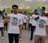 young kashmiris hold pakistan and azad jammu and kashmir flags at a rally commemorating burhan wani photo express