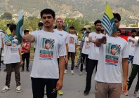 young kashmiris hold pakistan and azad jammu and kashmir flags at a rally commemorating burhan wani photo express