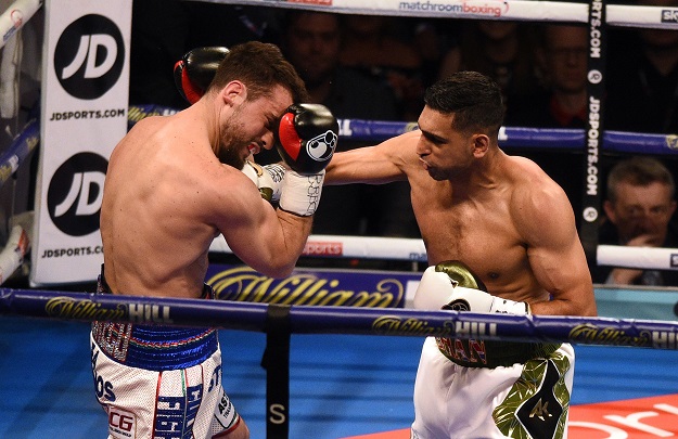 Amir Khan (R) fights Canada's Phil Lo Greco in their Super-Welterweight contest at the Echo Arena in Liverpool, northern England, on April 21, 2018. PHOTO: AFP