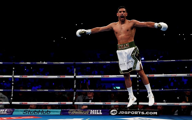 Amir Khan celebrates winning the fight. PHOTO: REUTERS