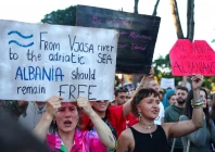 protesters hold banners during a protest against a luxury resort development planned by a company linked with donald trump s son in law jared kushner on an environmentally sensitive part of the adriatic coast in tirana albania on june 4 2026 photo reuters