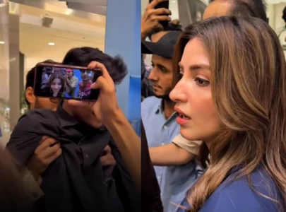 ali raza steps in as fan gets too close to kinza hashmi at karachi mall appearance