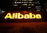 the logo of alibaba group is lit up at its office building in beijing china august 9 2021 reuters