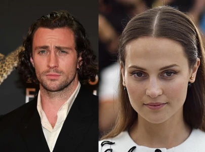 alicia vikander joins aaron taylor johnson in netflix s enigma variations
