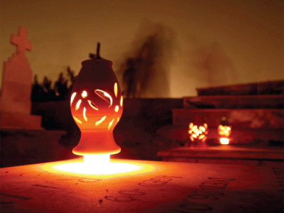 graveyard lit up as departed souls receive visitors graveyard lit up as departed souls receive visitors