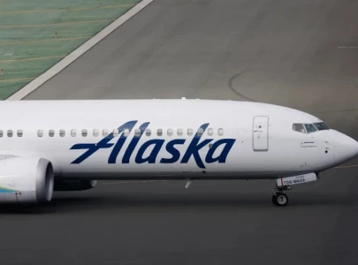 new video shows alaska airlines passenger opening emergency exit climbing onto plane wing in seattle new video shows alaska airlines passenger opening emergency exit climbing onto plane wing in seattle