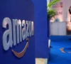 a visitor stands near a logo of amazon during the annual retail leadership summit in mumbai india february 27 2025 photo reuters