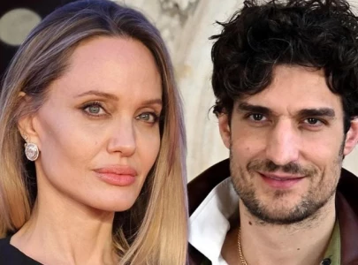 angelina jolie isn t dating couture co star louis garrel sources say angelina jolie isn t dating couture co star louis garrel sources say