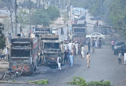 enraged protesters torched multiple dumpers on rashid minhas road after a fatal dumper bike collision photo file online