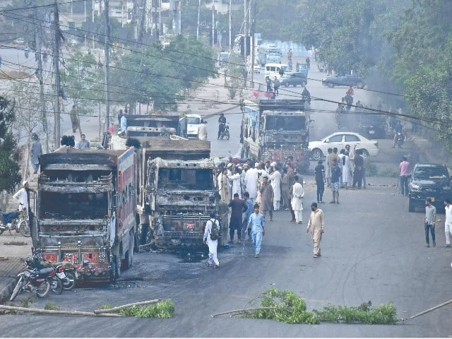 enraged protesters torched multiple dumpers on rashid minhas road after a fatal dumper bike collision photo online