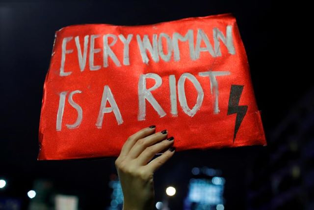 a demonstrator holds a placard during a protest against a verdict restricting abortion rights in warsaw poland january 27 2021 reuters