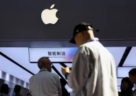 people walk past a booth showcasing apple s suppliers during the china international supply chain expo cisce in beijing china june 22 2026 photo reuters file